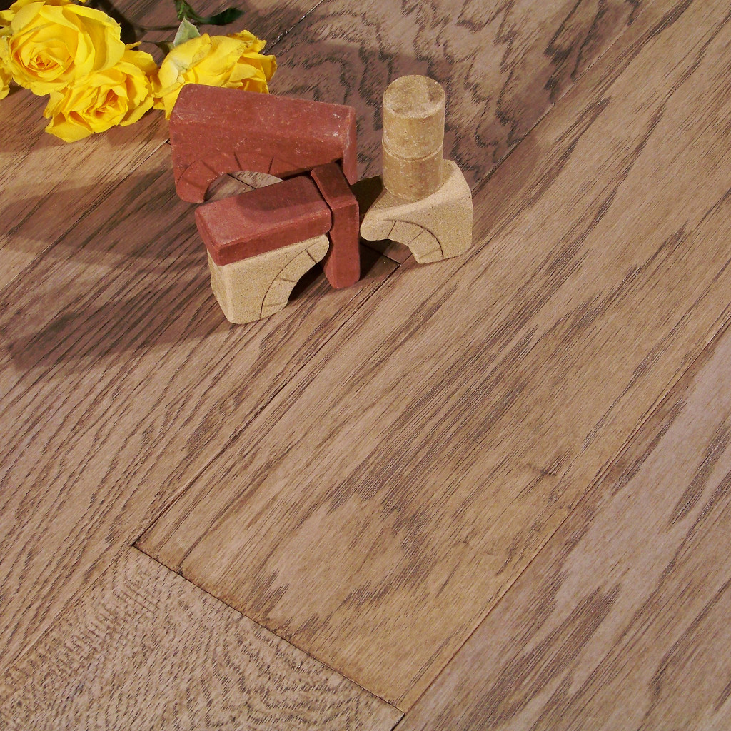 Close up picture of Woodhouse, Brentwood, Hampton Wood Flooring with yellow roses and building blocks