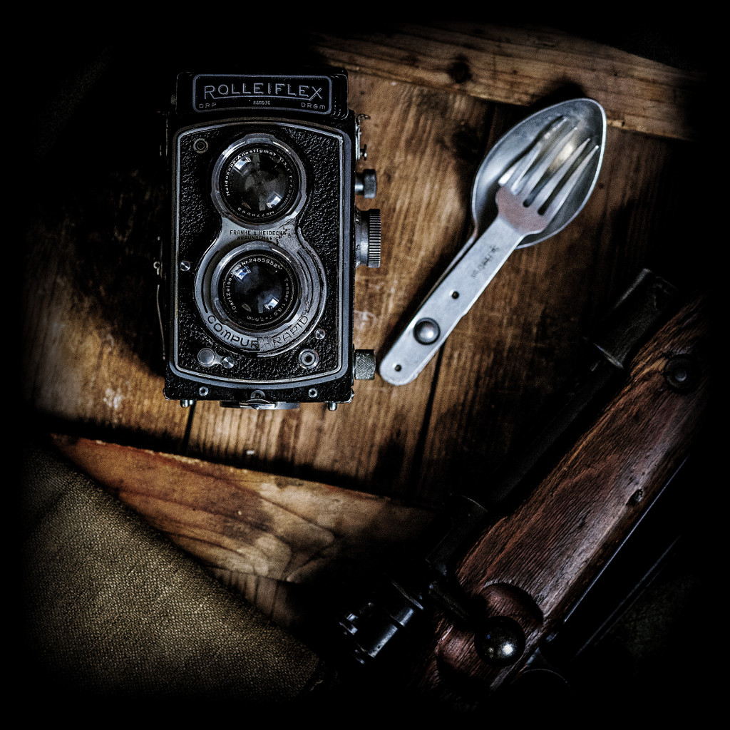 Vintage photo of camera and camping utensils