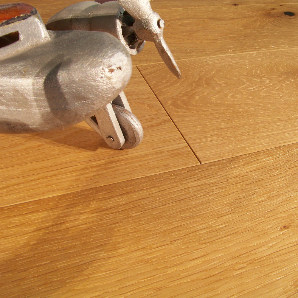 Woodhouse, Macon Essential Oak engineered wood floor shown with toy airplane
