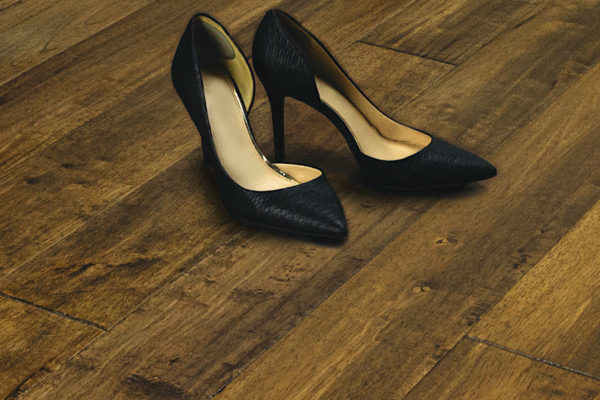 Woman's high heel shoes on wood flooring