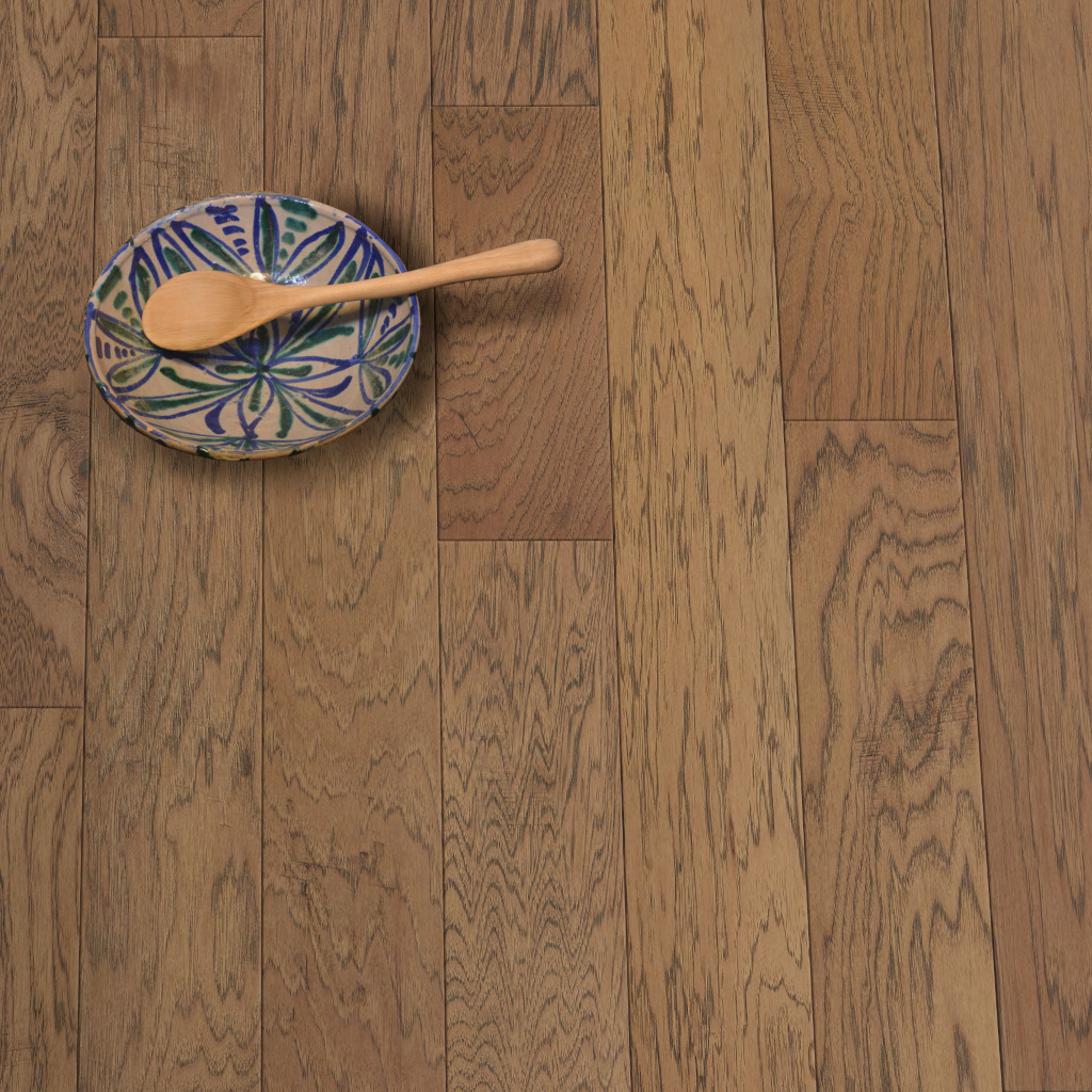 Woodhouse, Bruneau Rolling Dunes engineered wood floor shown with a bowl and wooden spoon