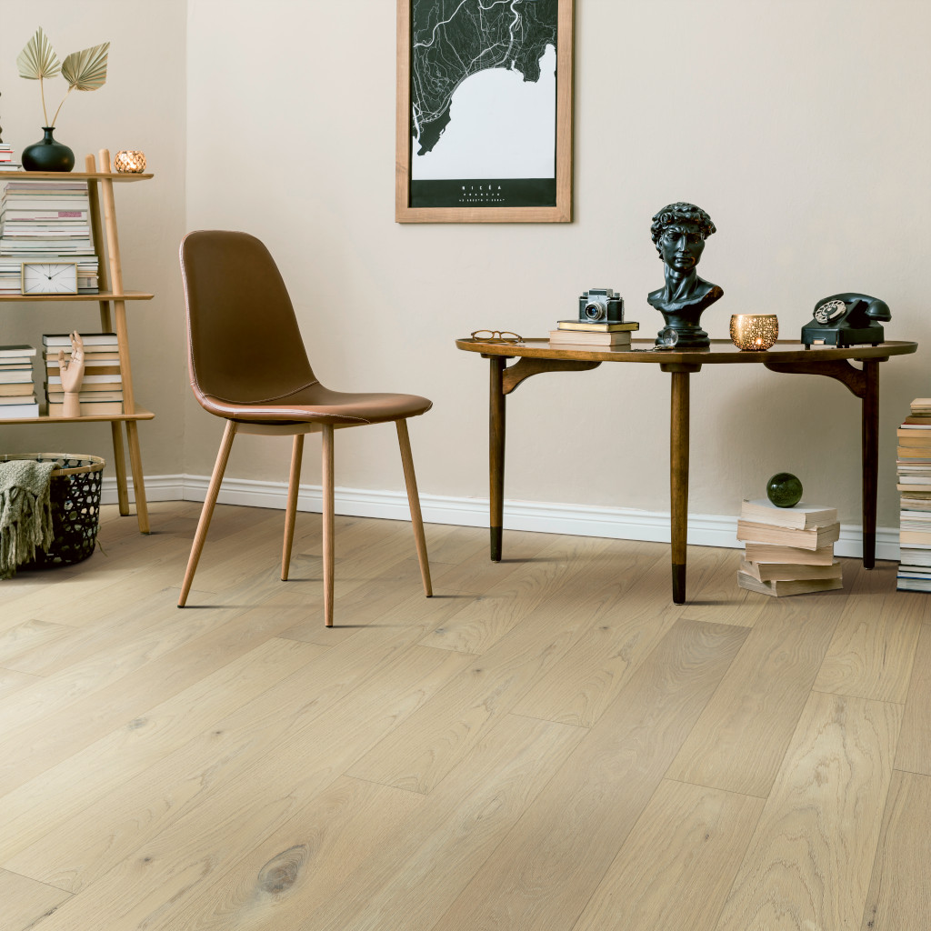 Woodhouse, Rushmore White Oak Engineered Wood Floor shown in a stylish library room with retro furniture.
