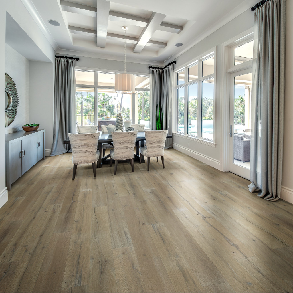 Woodhouse, Stones River White Oak Engineered Wood Floor shown in a spacious dining room with tall windows and coffered ceiling